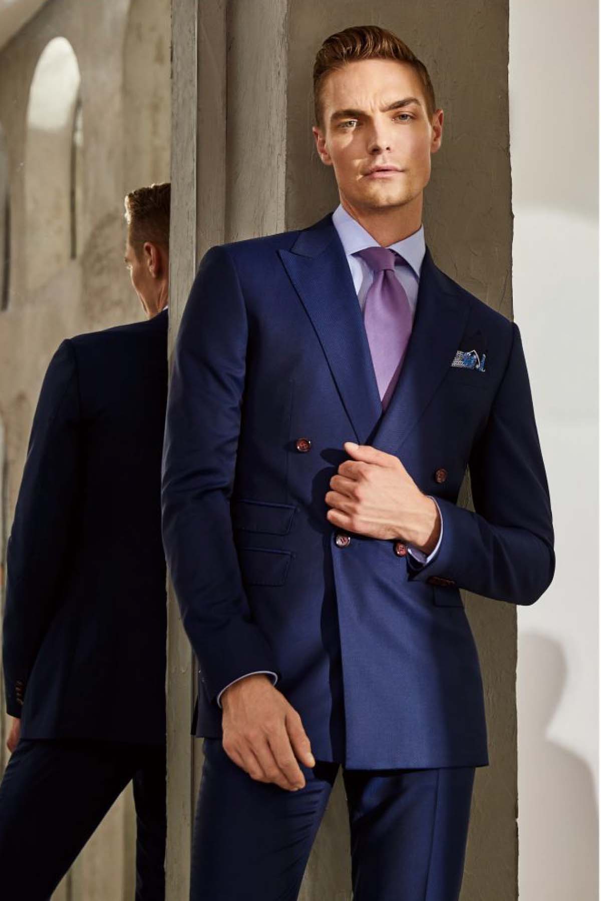 Male model wearing a tailored blue suit – modern formal menswear