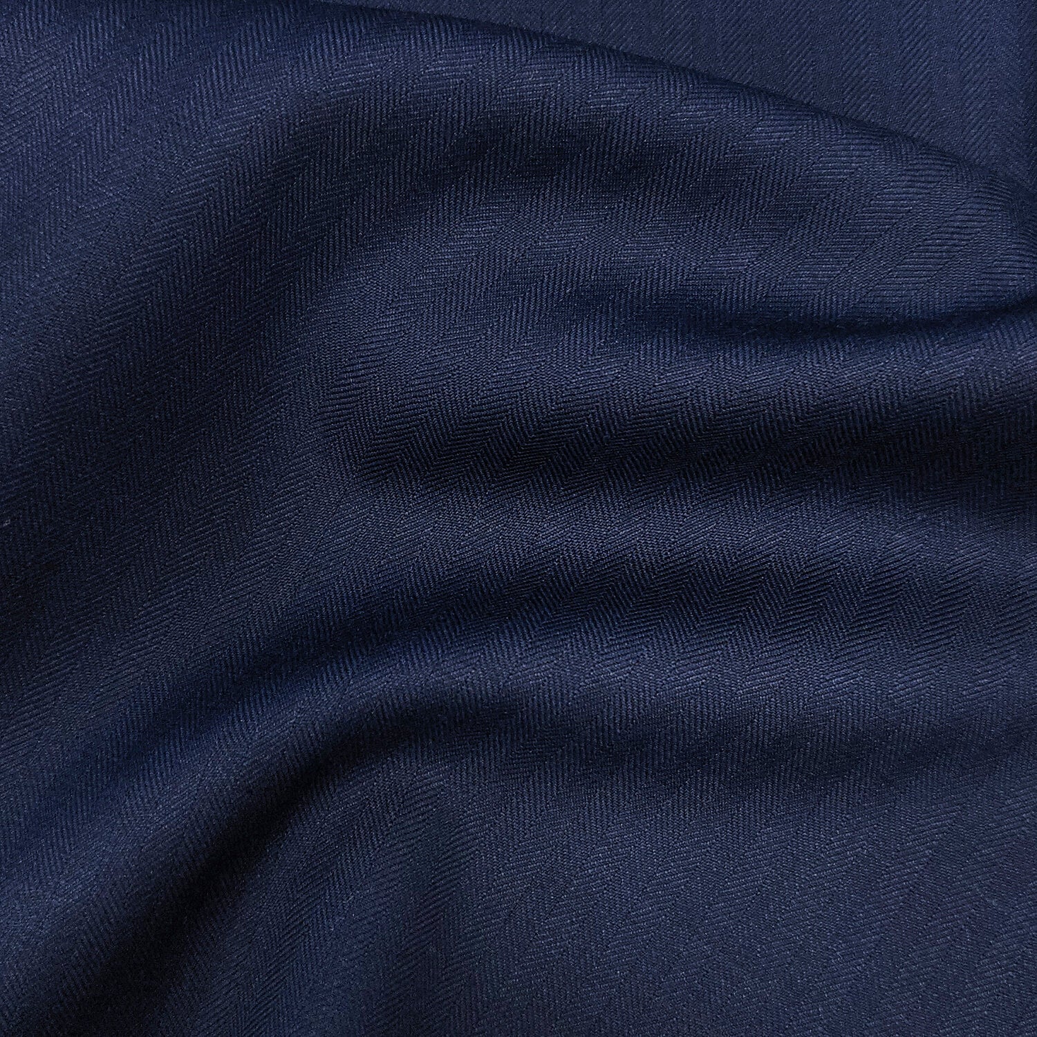 Custom navy herringbone suit on mannequin – men's formalwear
